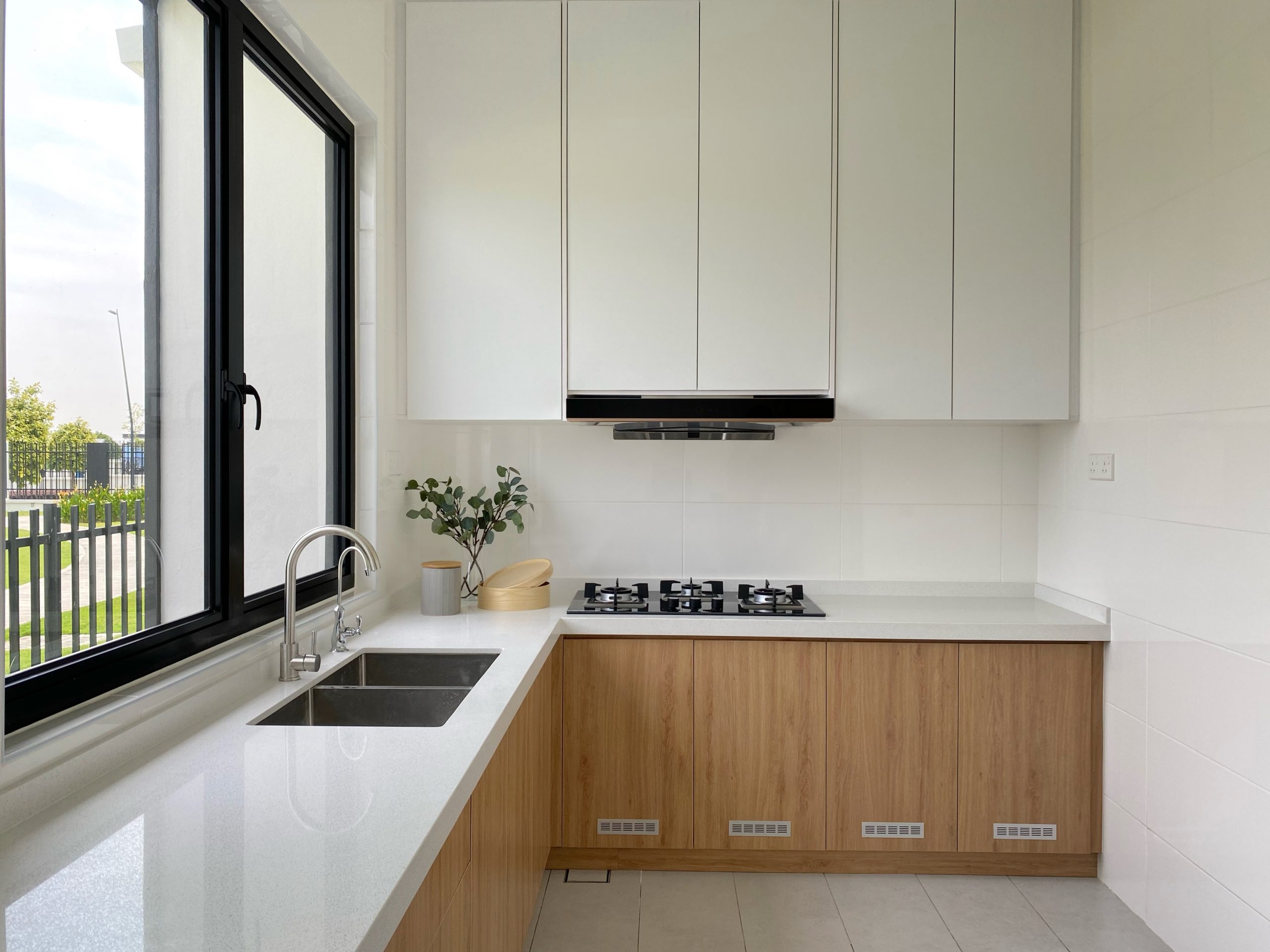 White & wooden themed kitchen cabinets.