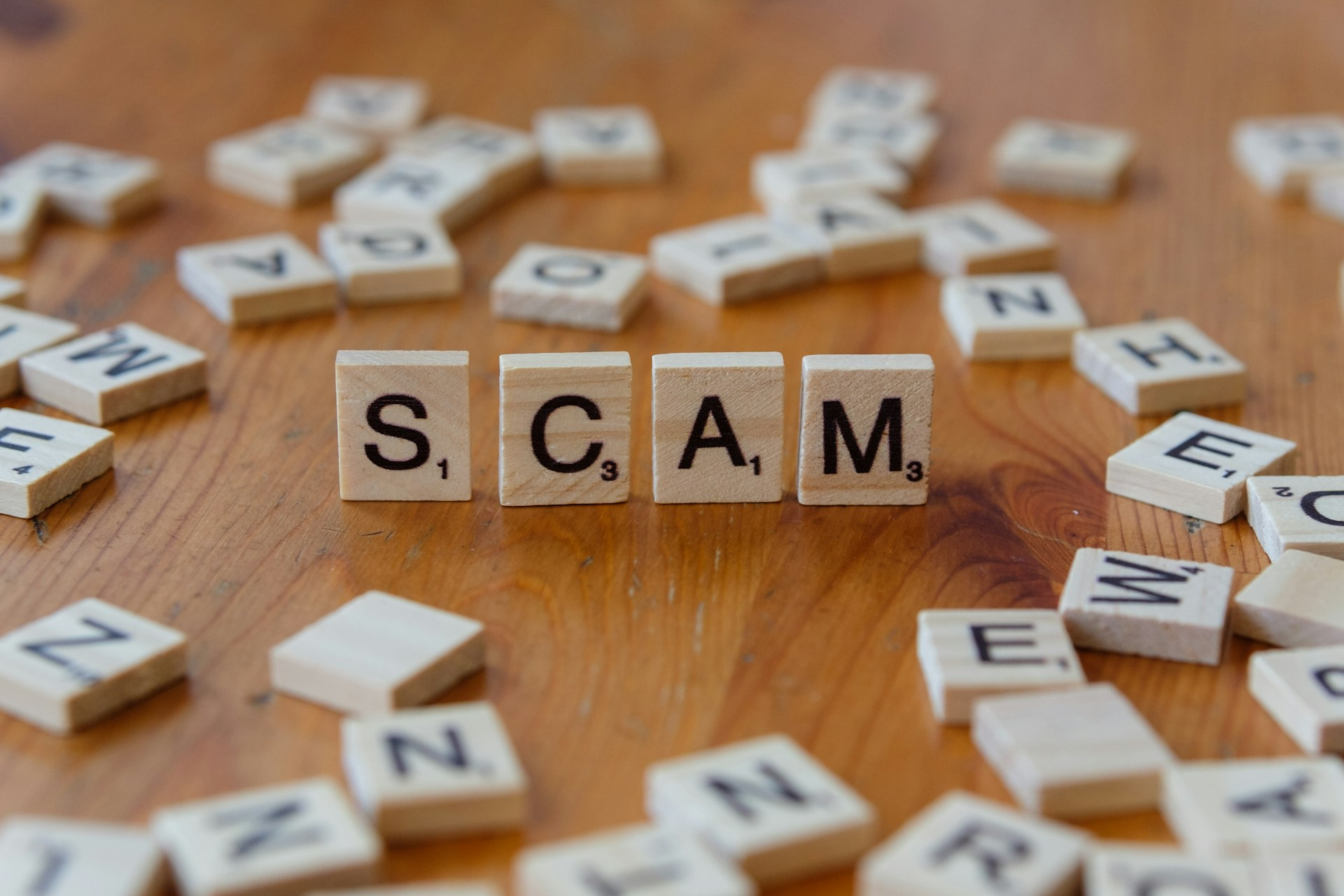 blocks with word Scam